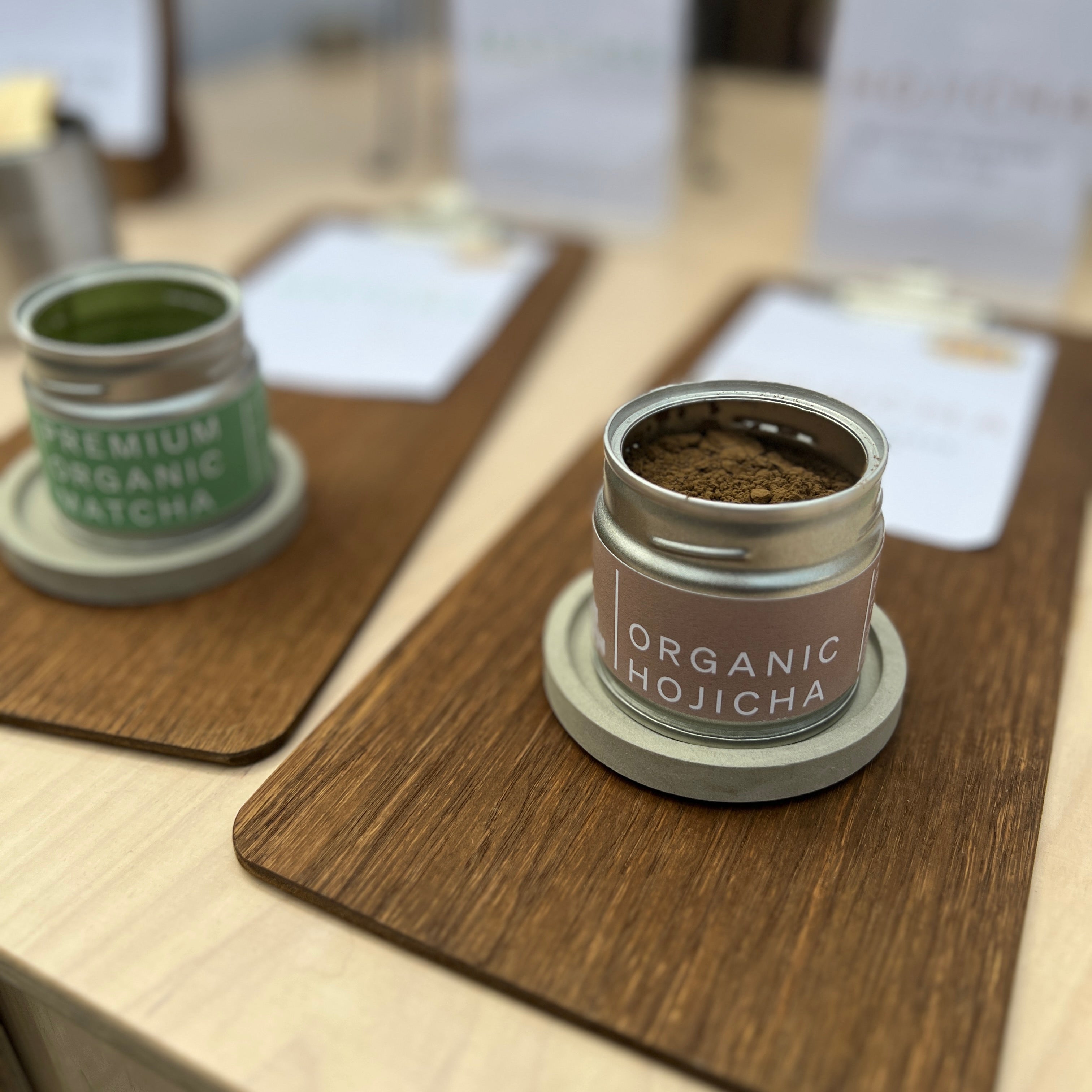 Organic Hojicha and Premium Organic Matcha in tins - display