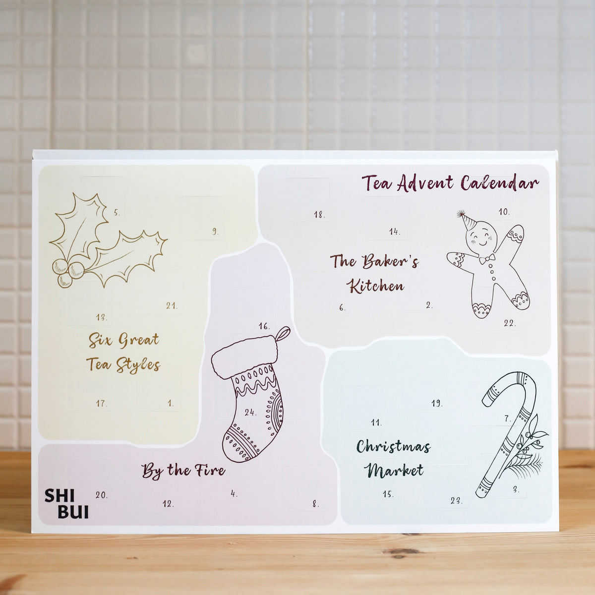 Reusable tea advent calendar with numbered doors revealing a different loose leaf tea each day